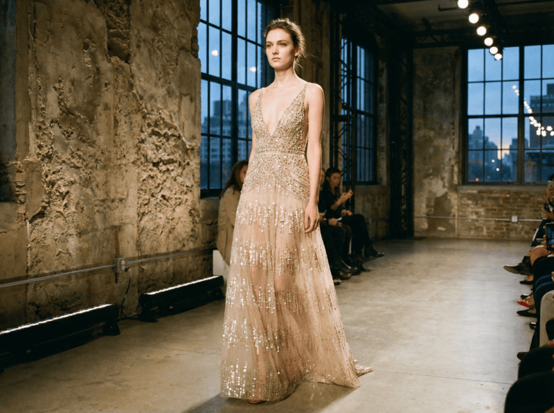 AI-generated couture outfit with champagne beaded gown on a runway.